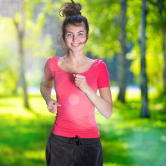 Runner - woman running outdoors in green park