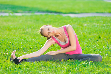 Woman doing stretching fitness exercise. Yoga postures