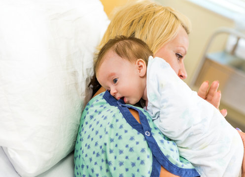 Babygirl Resting On Mother's Shoulder In Hospital