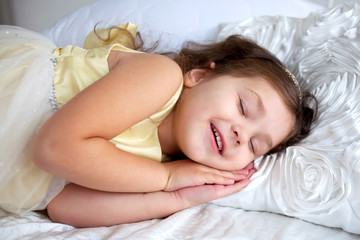 Obraz na płótnie Canvas Happy smiling kid sleeping and smiling