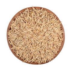 Oat seeds in a wooden bowl