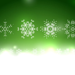 Vector green Christmas card bokeh snowflakes