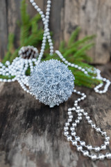 Silver Christmas ball on wooden background