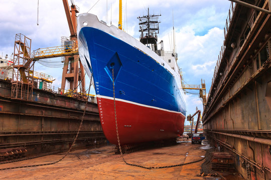 Cargo ship is being renovated in shipyard Gdansk, Poland.
