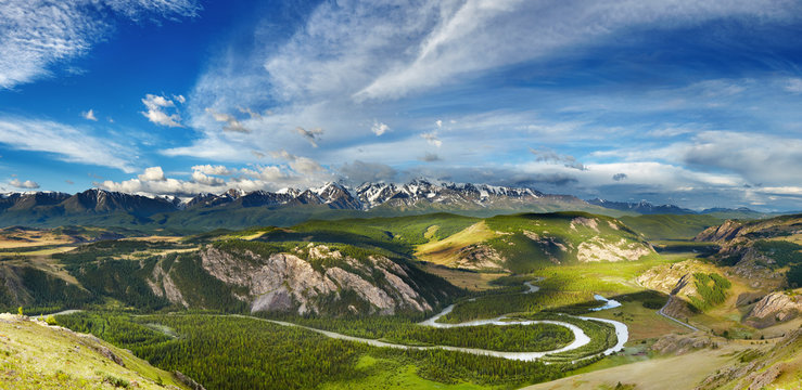 Mountain landscape with river and snowy peaks