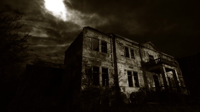 Abandoned rustic hotel at night