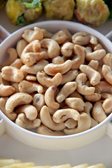 Cashews in white dish.