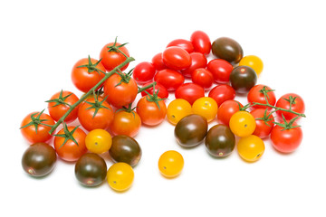Naklejka na ściany i meble tomatoes of different varieties and colors on a white background