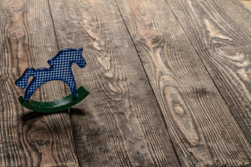 Christmas background with hors on wooden table