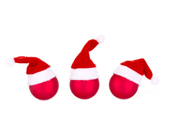Drei Christbaumkugeln mit Nikolausmützen