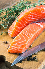 Trout and rosemary on a wooden board