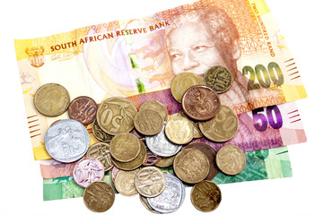 Scattered  Coins on Three South African Bank Notes