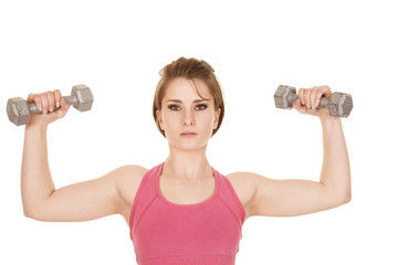 Obraz na płótnie Canvas woman pink tank top flex with weights up
