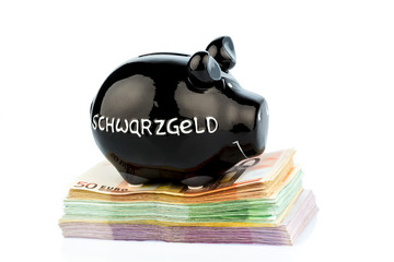Schwarzes Sparschwein auf Geld