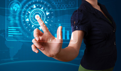 Woman pressing high tech type of modern buttons