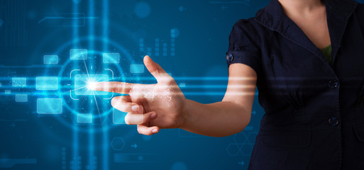 Woman pressing high tech type of modern buttons