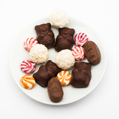 chocolate and sugar candies over white