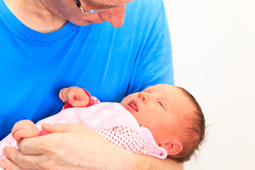 father with newborn daughter