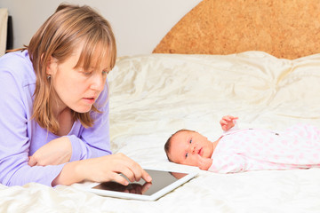 mother with newborn working from home