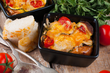 Two dishes of vegetable casserole