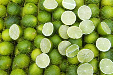 Fresh Limes Hang in Sacks at Farmers Market Rio de Janeiro