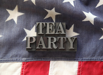 tea party in metal type on American flag