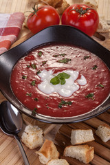 delicious homemade tomato soup with cream and basil