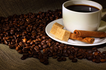 Coffee beans and white cup