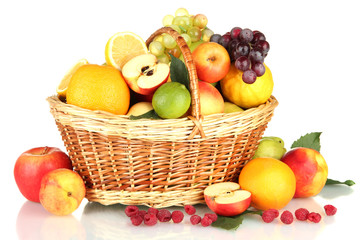 Assortment of exotic fruits in basket, isolated on white