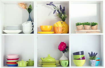 Beautiful white shelves with tableware and decor.