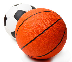 Basketball and football balls isolated on white
