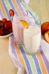 Delicious milk shakes with strawberries and peach