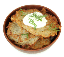 Potato pancakes in bowl, isolated on white