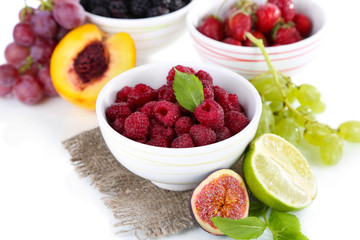 Raspberries and blackberry in small bowls