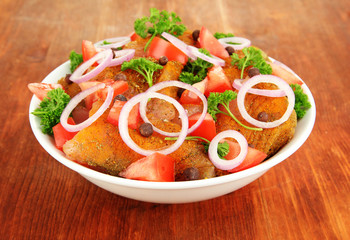 Turkey meat in bowl on wooden table close up