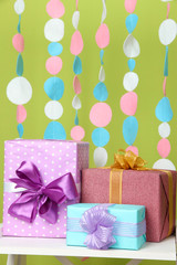 Beautiful presents on table on bright background