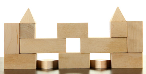 Wooden toy blocks on table on white background