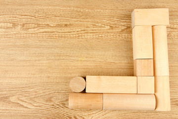 Wooden toy blocks on wooden background