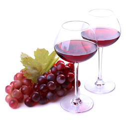 Wineglasses with red wine, grape isolated on white