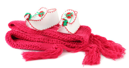 Decorative Christmas shoes on scarf isolated on white