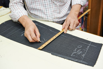 Tailor hands at works