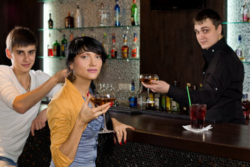 Two young friends relaxing in a pub