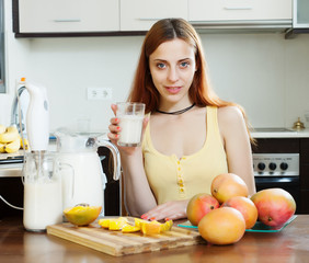 woman  drinking milk shake with mango