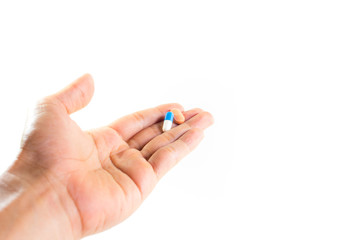 pills on hand with white background