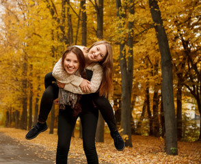 piggyback ride in autumn forest