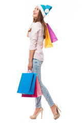 Woman in Christmas hat with shopping bags
