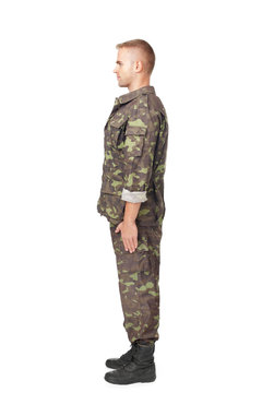 Full body side view of army soldier standing in attention