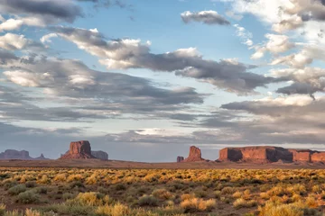  Monument Valley view on cloudy sky background © Andrea Izzotti