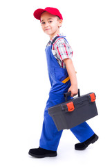 Little handyman carrying toolbox