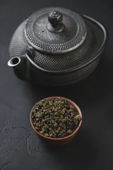 Foto op Aluminium Ceramic pialat with green tea and cast-iron teapot, studio shot © Nickola_Che